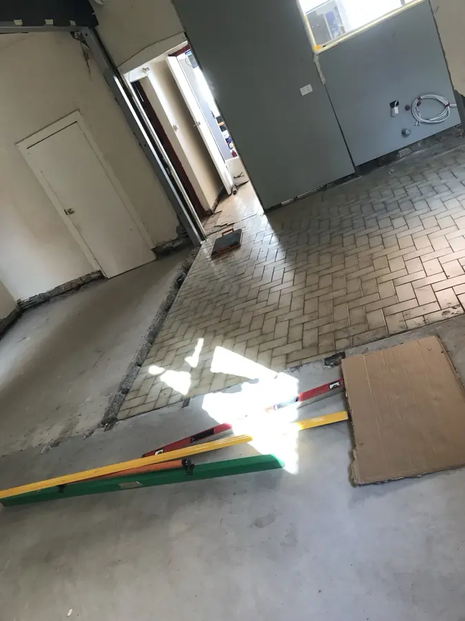 Existing paver and uneven floor before levelling work