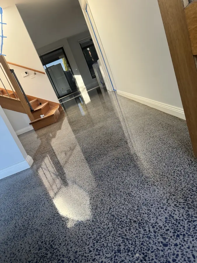 Exposed aggregate polished concrete hallway